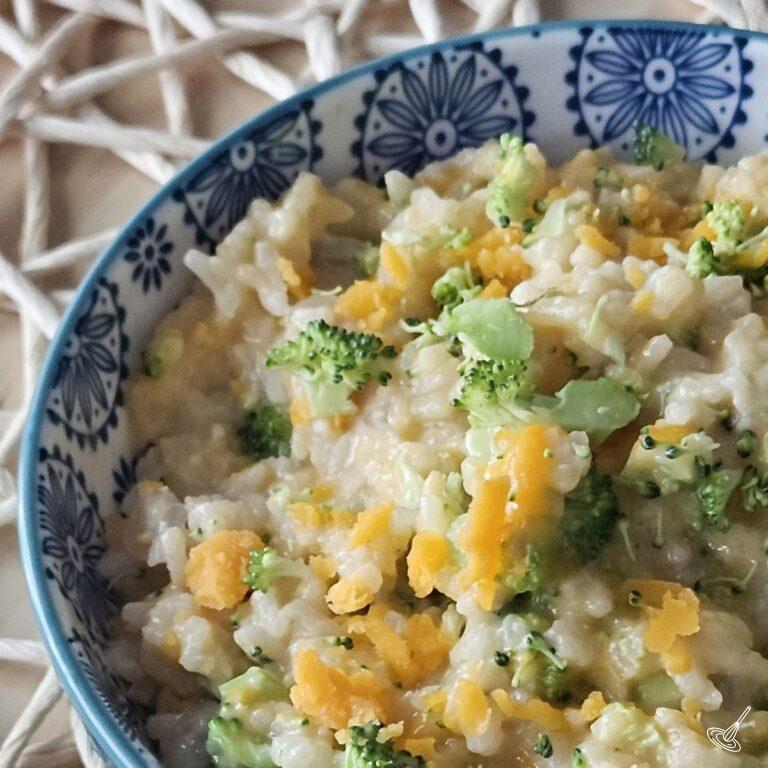 This is an image of Cheesy Rice with broccoli in a bowl.