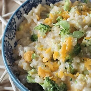 This is an image of a bowl of Cheesy Rice with broccoli.