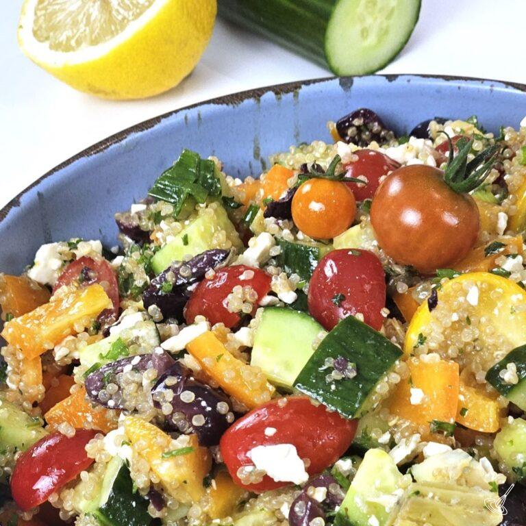 This is an image of Greek Quinoa Salad inside of a bowl.