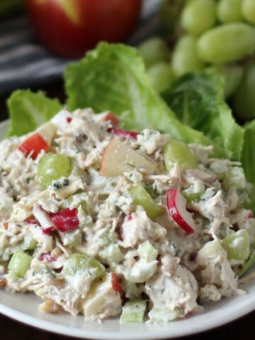 Waldorf Chicken Salad on a bed of lettuce.