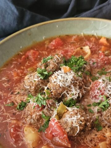 This is a zoomed in picture of a bowl of Italian Meatball Soup