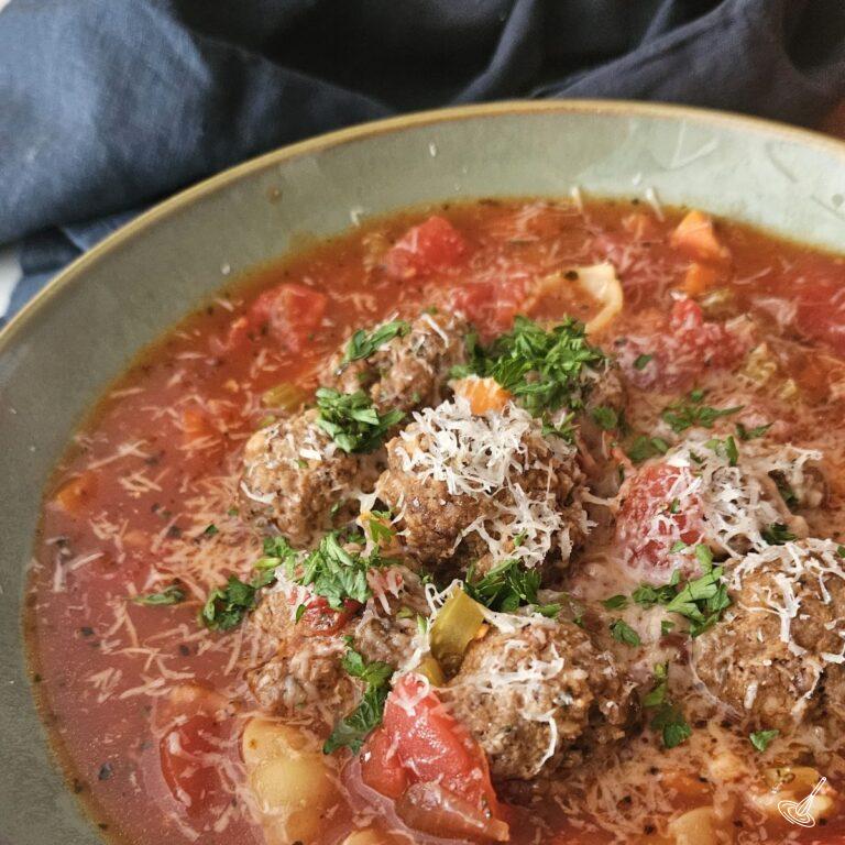 This is a zoomed in picture of a bowl of Italian Meatball Soup