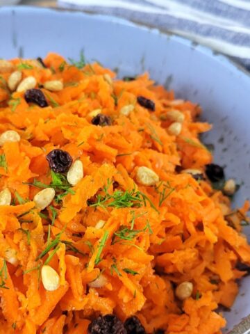 This is an image of a bowl of Raw Carrot Salad.