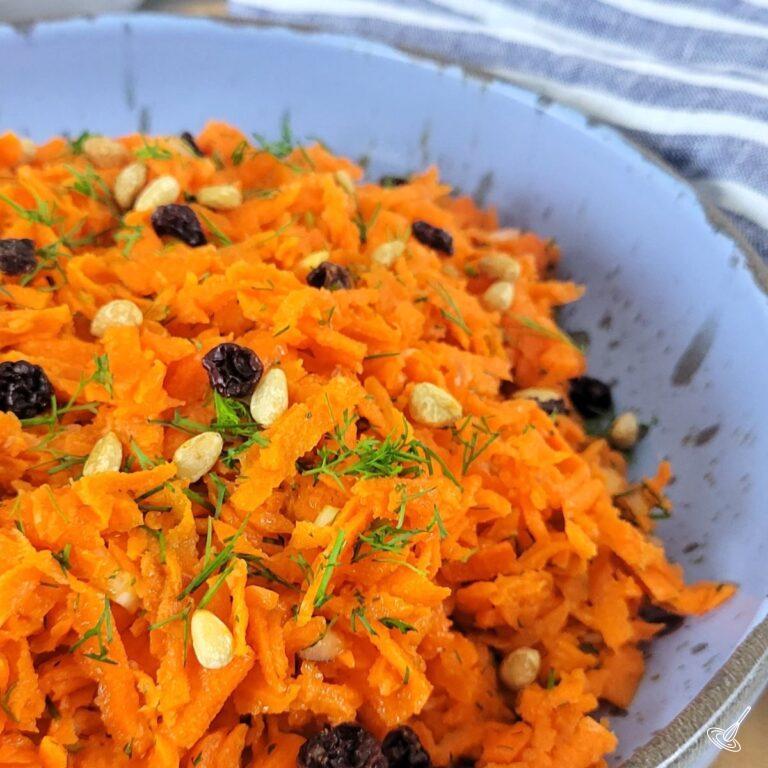 This is an image of a bowl of Raw Carrot Salad.