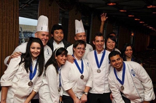 A graduation group of culinary chefs.