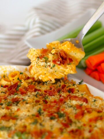 Spoonful of Buffalo Chicken Mac and Cheese oven a dish of pasta.