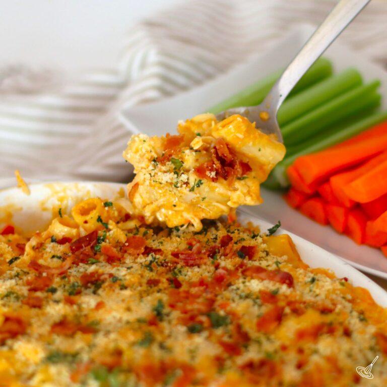 Spoonful of Buffalo Chicken Mac and Cheese oven a dish of pasta.