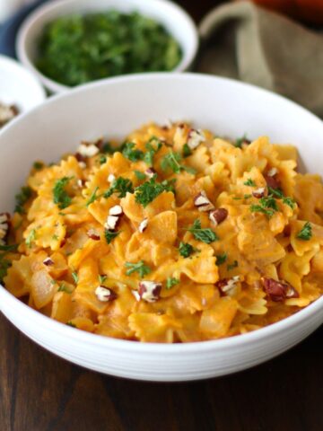Pumpkin Pasta Sauce Recipe made with farfalle pasta in a bowl.