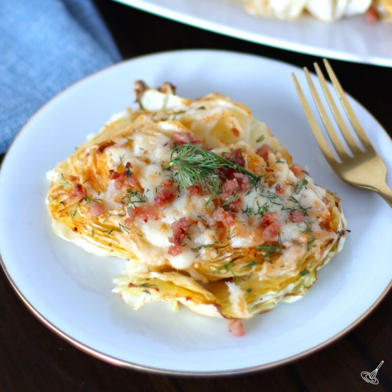 Cheesy Cabbage Steak on a plate.