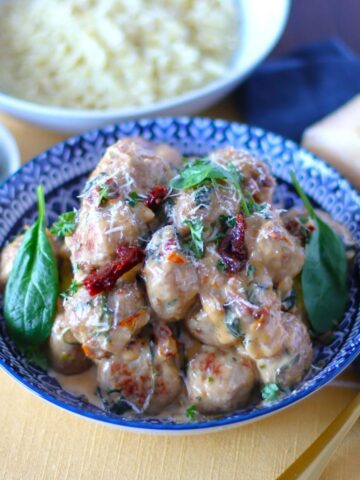 Creamy Spinach Turkey Meatballs in a serving bowl.