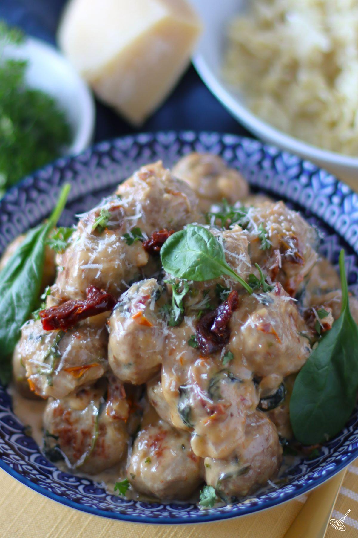 Creamy Spinach Turkey Meatballs in a serving bowl.