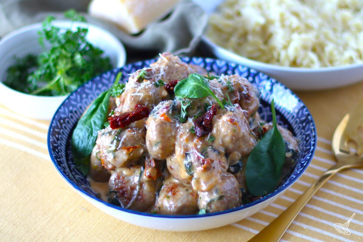 Creamy Spinach Turkey Meatballs in a large serving bowl.