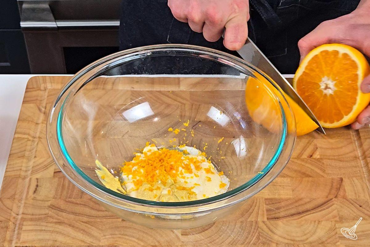 Citrus zest with mayonnaise and Greek yogurt in a bowl.