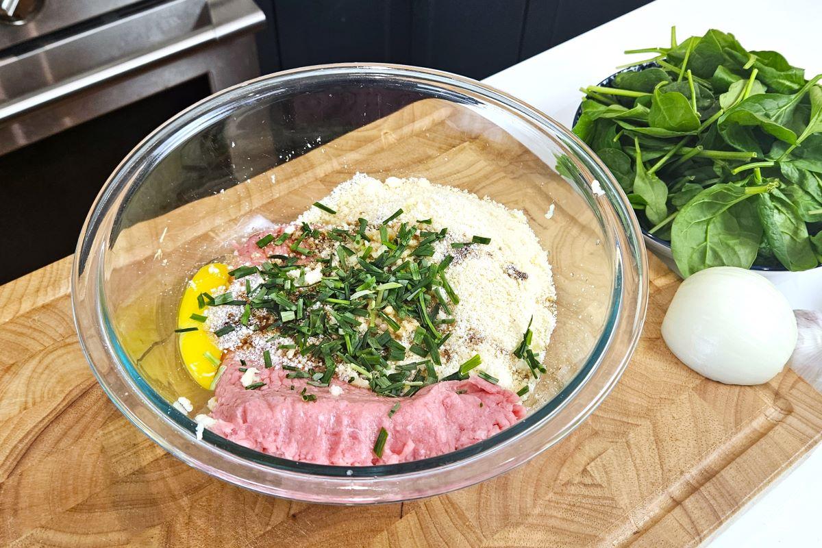 Ground meat, egg, and panko crumbs in a large mixing bowl. 