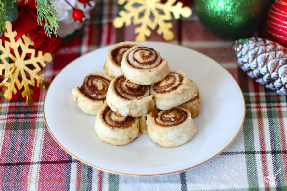 A small stack of spiral cookies on a plate.