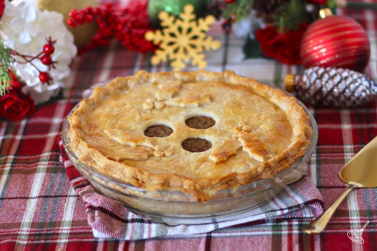A Traditional French Canadian Tourtière on a festively decorated table. 