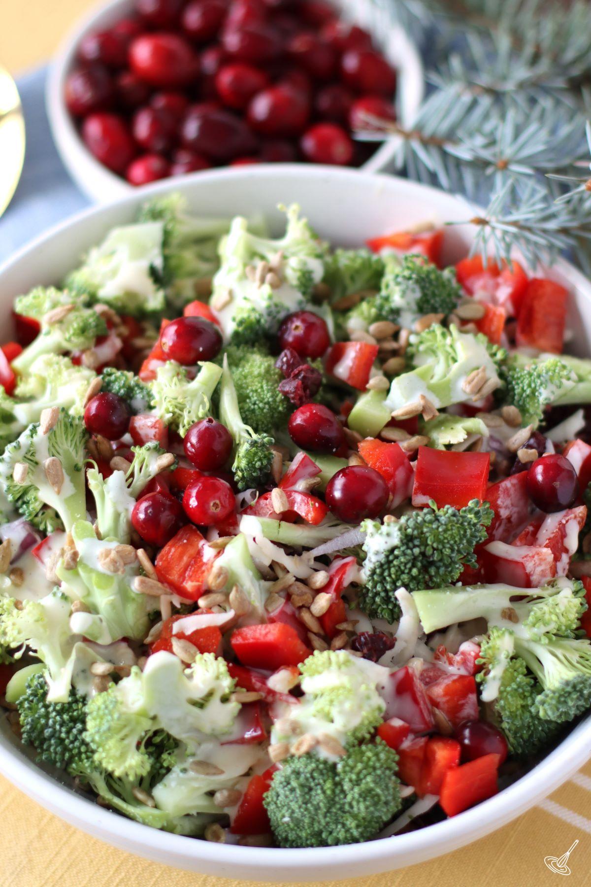 Broccoli Salad with Cranberries and sunflower seeds in a serving bowl. 