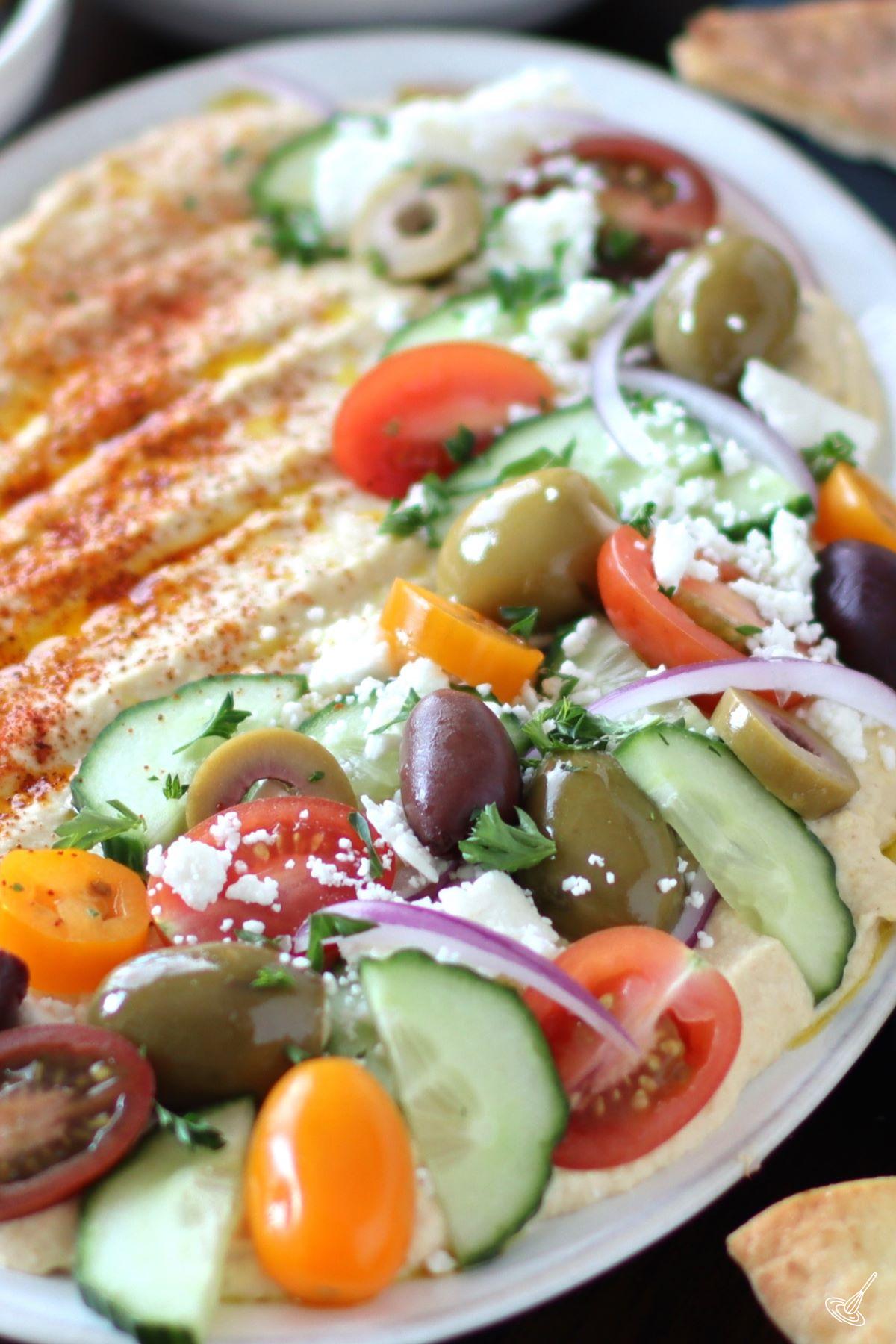 Greek Loaded Hummus on a platter.