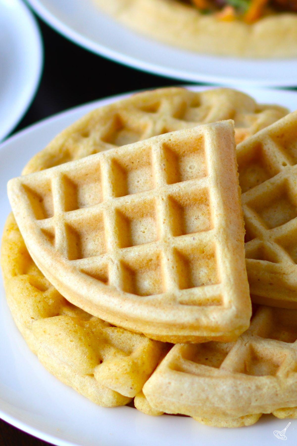 A stack of Cornbread Waffles on a plate.
