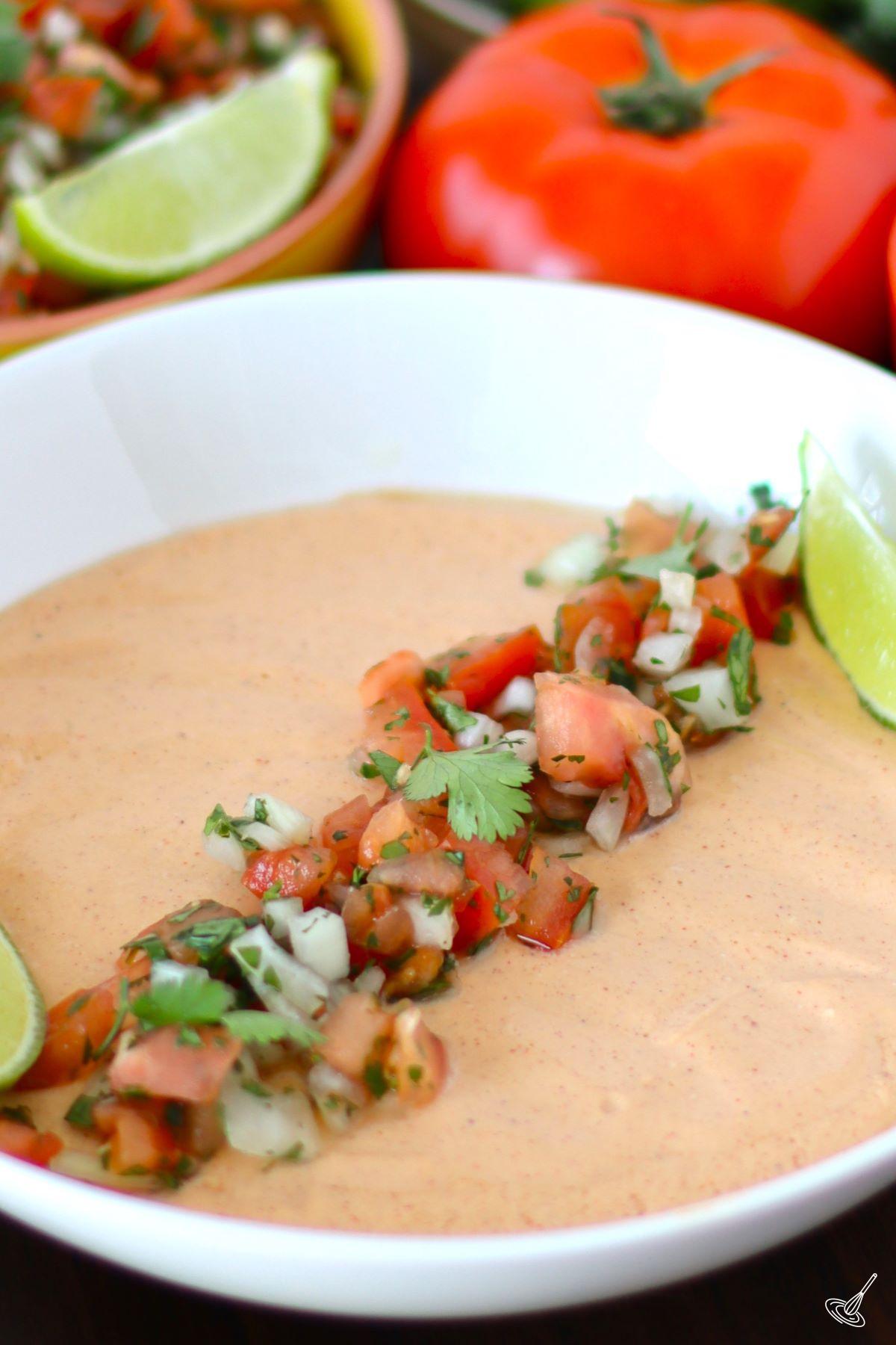 Cottage Cheese Queso in a bowl with fresh salsa.