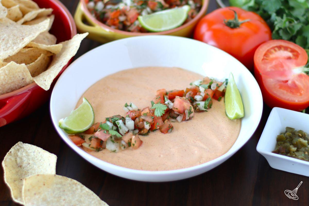 Dip in a bowl with fresh salsa on top.