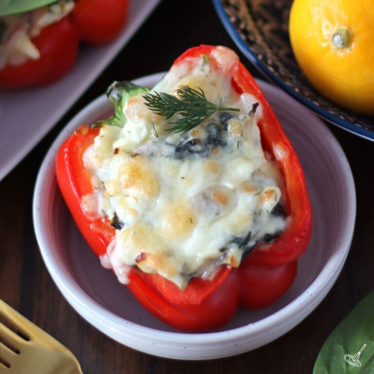 Spanakopita Stuffed Bell Pepper in a white dish.