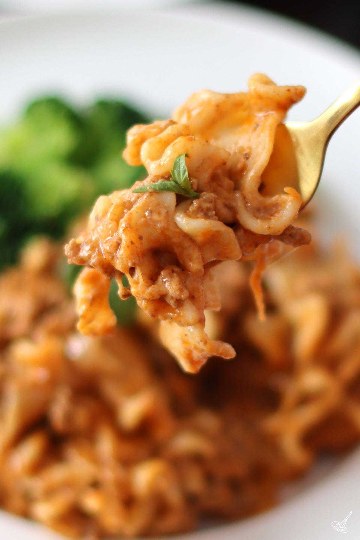 A fork holding a piece of beefaroni pasta recipe.
