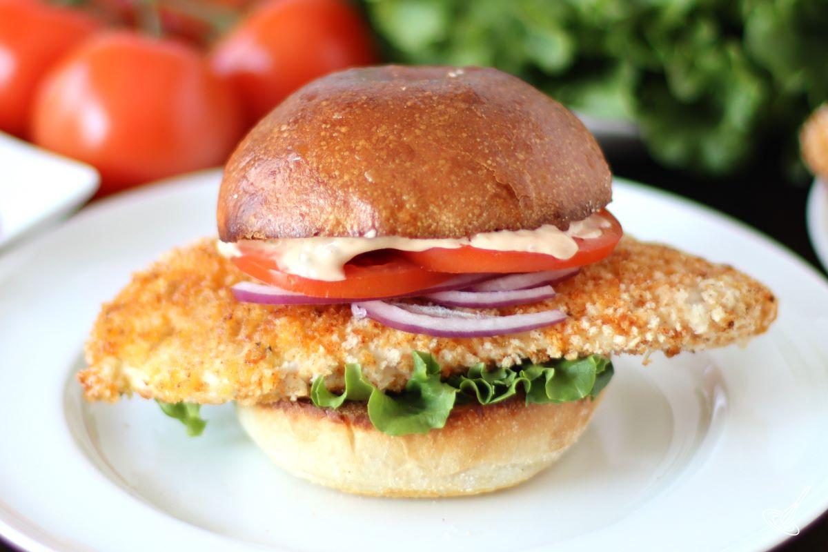 A Crispy Cajun Chicken Sandwich on a plate. 