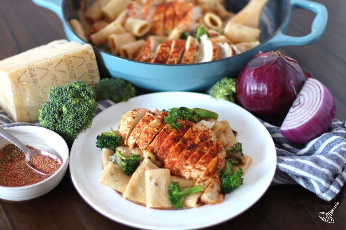 Cajun Chicken and Broccoli Alfredo on a white plate. 