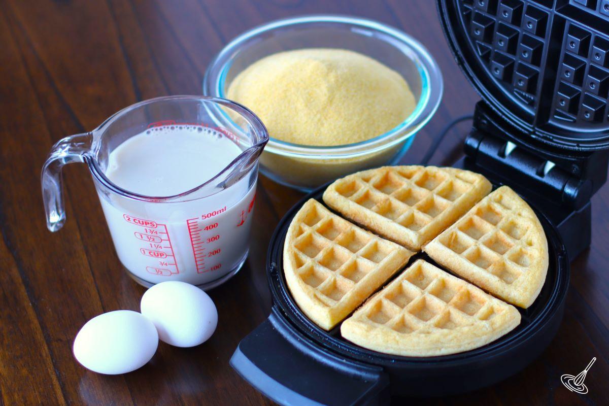 A waffle iron cooking waffles.