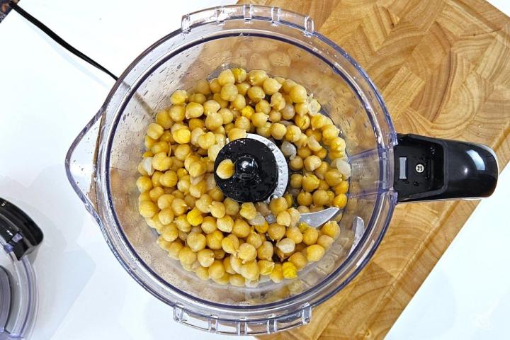 Chickpeas inside of a food processor.