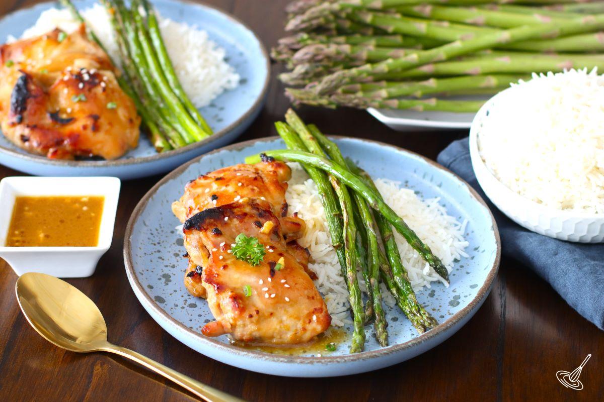Sheet Pan Miso Honey Chicken and asparagus with rice on a plate. 