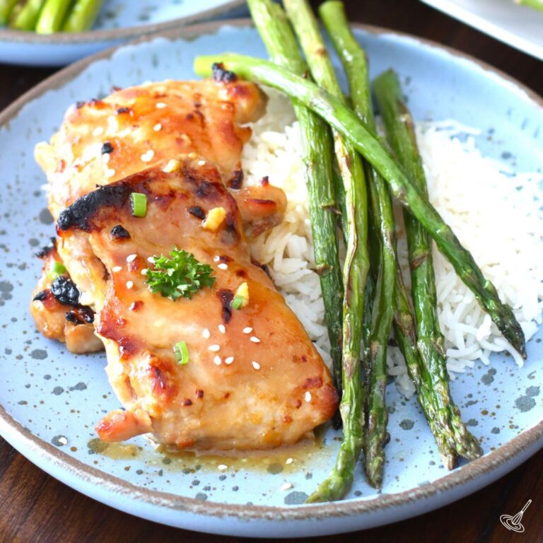 Sheet Pan Miso Honey Chicken with asparagus and rice on a plate.