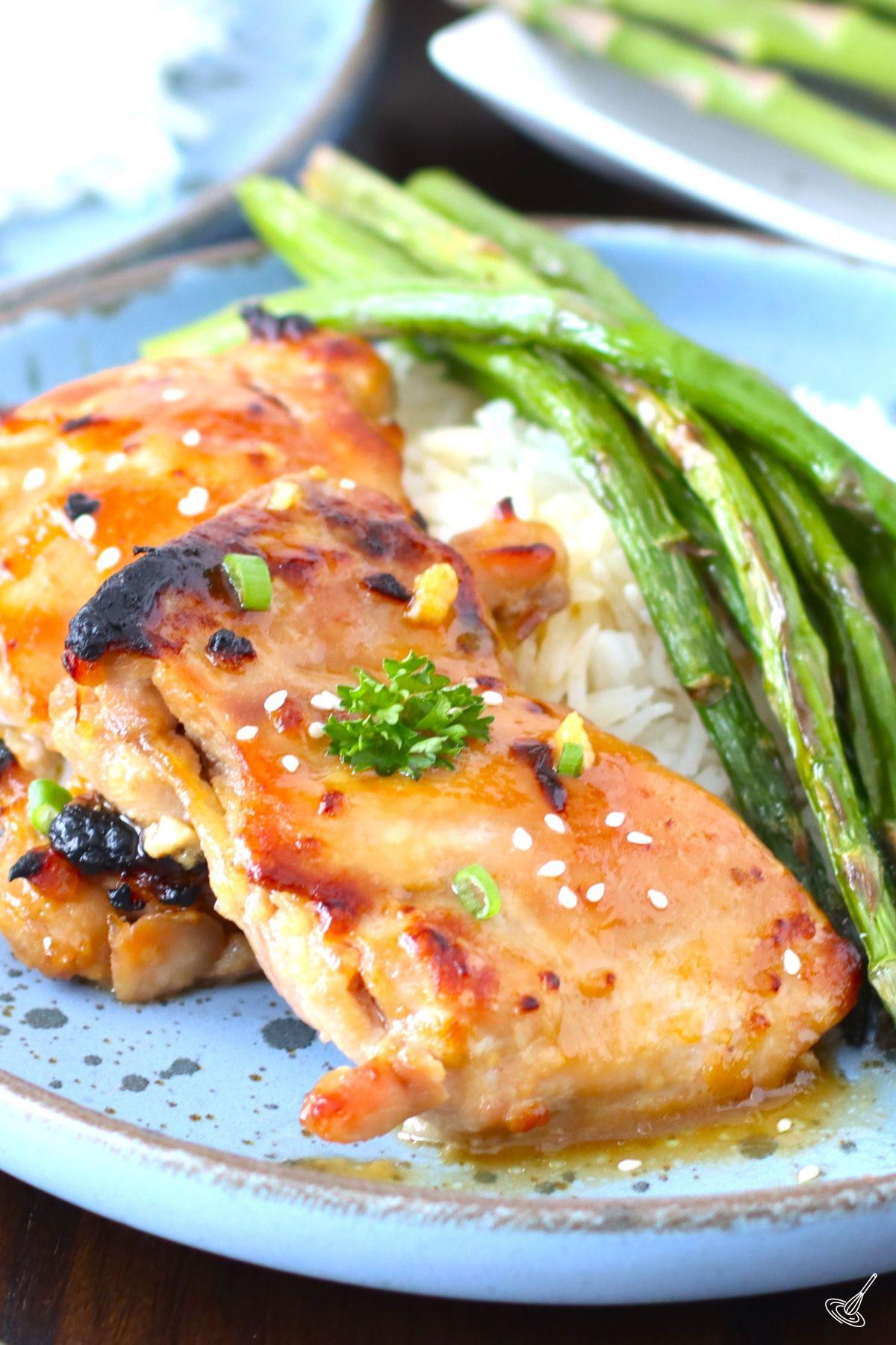 Sheet Pan Miso Honey Chicken on a plate with asparagus and rice.