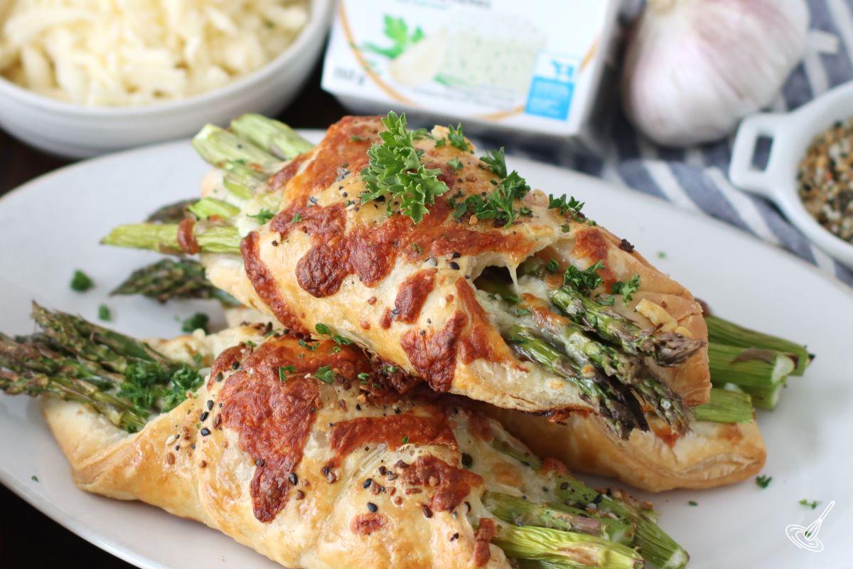 A stack of Alfredo Asparagus Bundles on a plate.