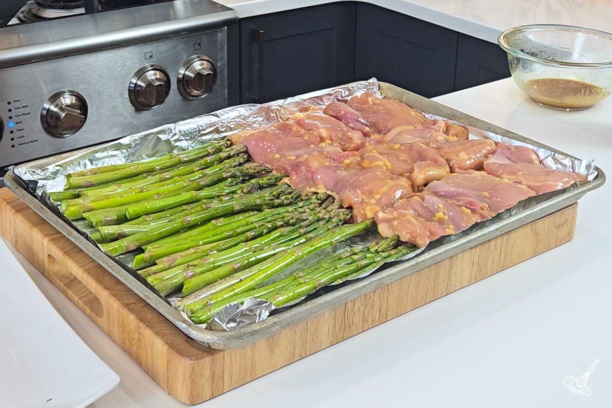 A Sheet Pan of Miso Honey chicken and asparagus . 