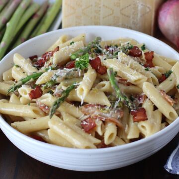 Creamy Pasta with Asparagus and Bacon in a bowl.