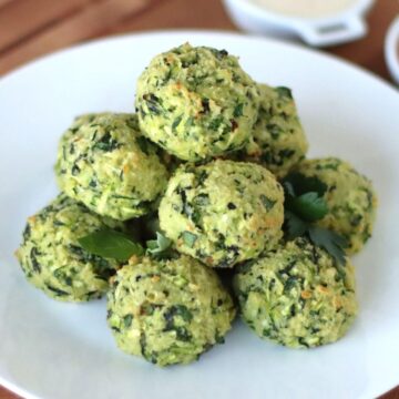 Zucchini Garlic Bites on a white plate.
