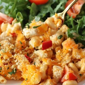 Cajun Chicken Mac and Cheese on a plate with salad.