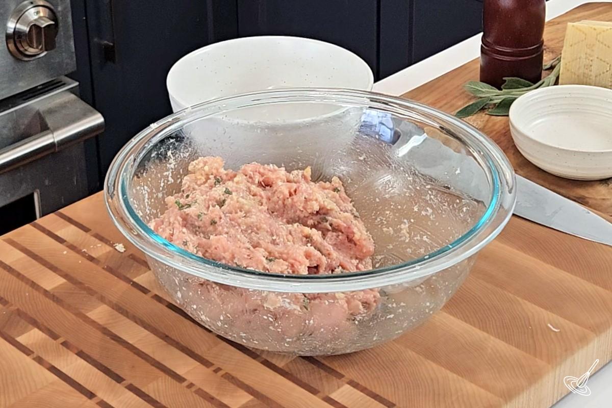 Mixture for sage chicken meatballs in a bowl. 