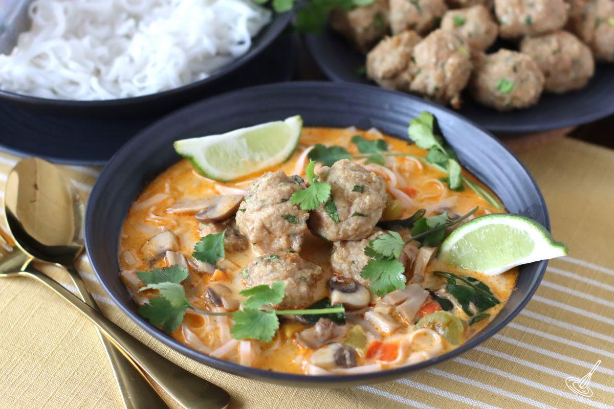 Thai inspired chicken meatball soup in a bowl.