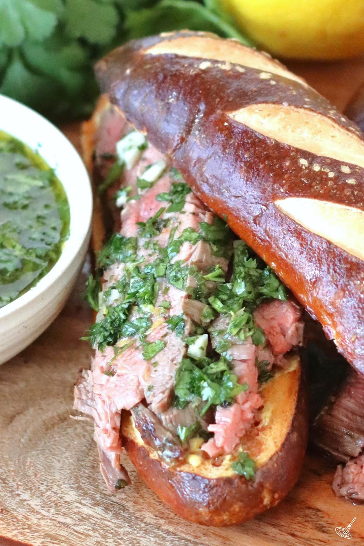 Chimichurri Steak Sandwich on a wooden board.