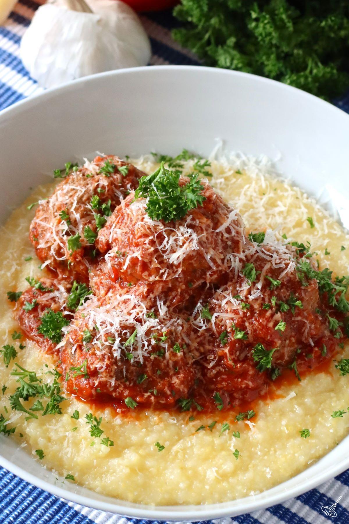 Italian Meatballs with Polenta in a serving bowl.