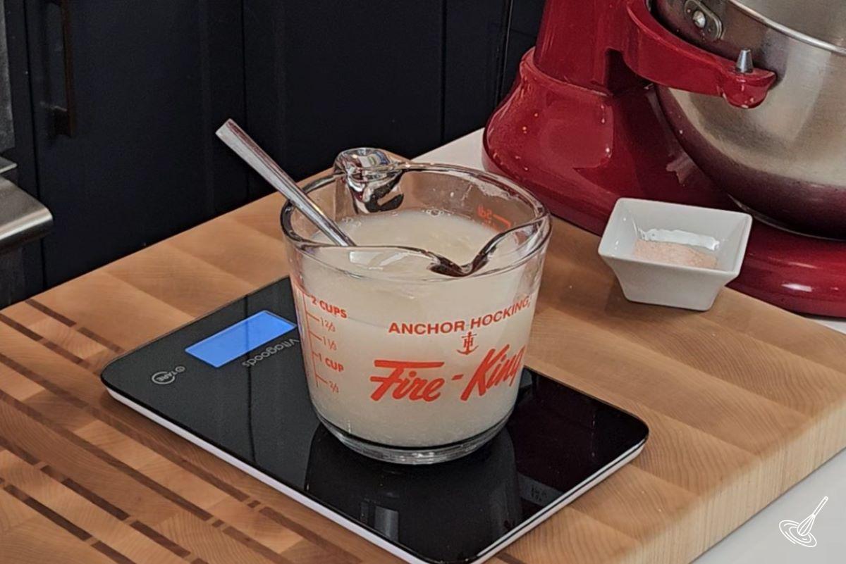 A measuring cup filled with water. 