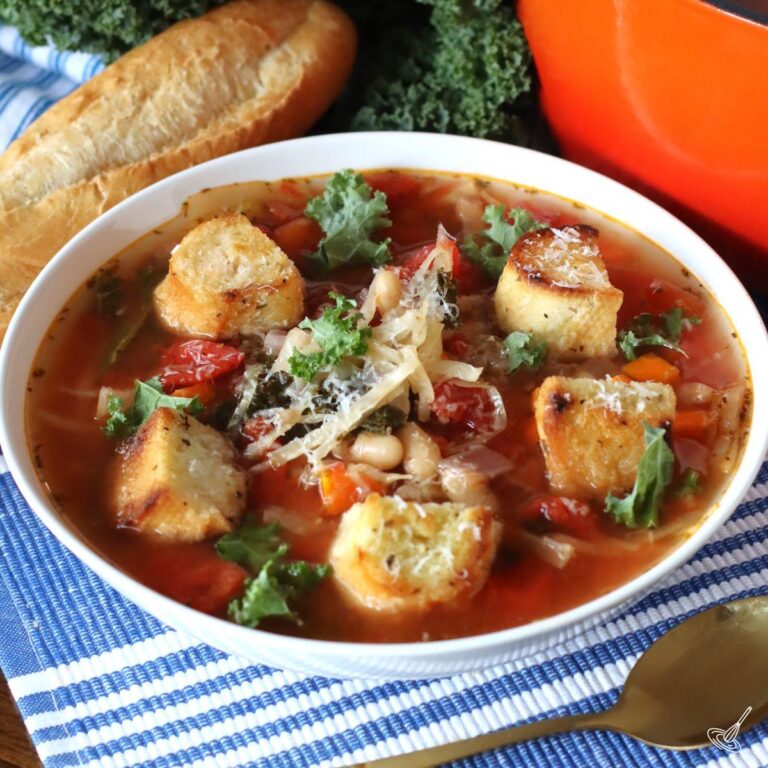 Cabbage and Kale Soup in a white bowl.