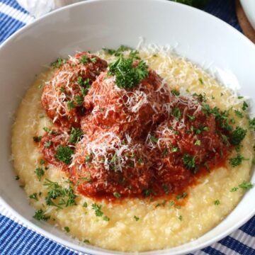 Italian Meatballs with Polenta in a serving bowl.
