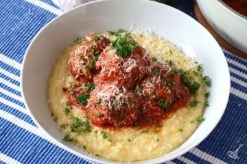 Italian Meatballs with Polenta in a serving bowl.