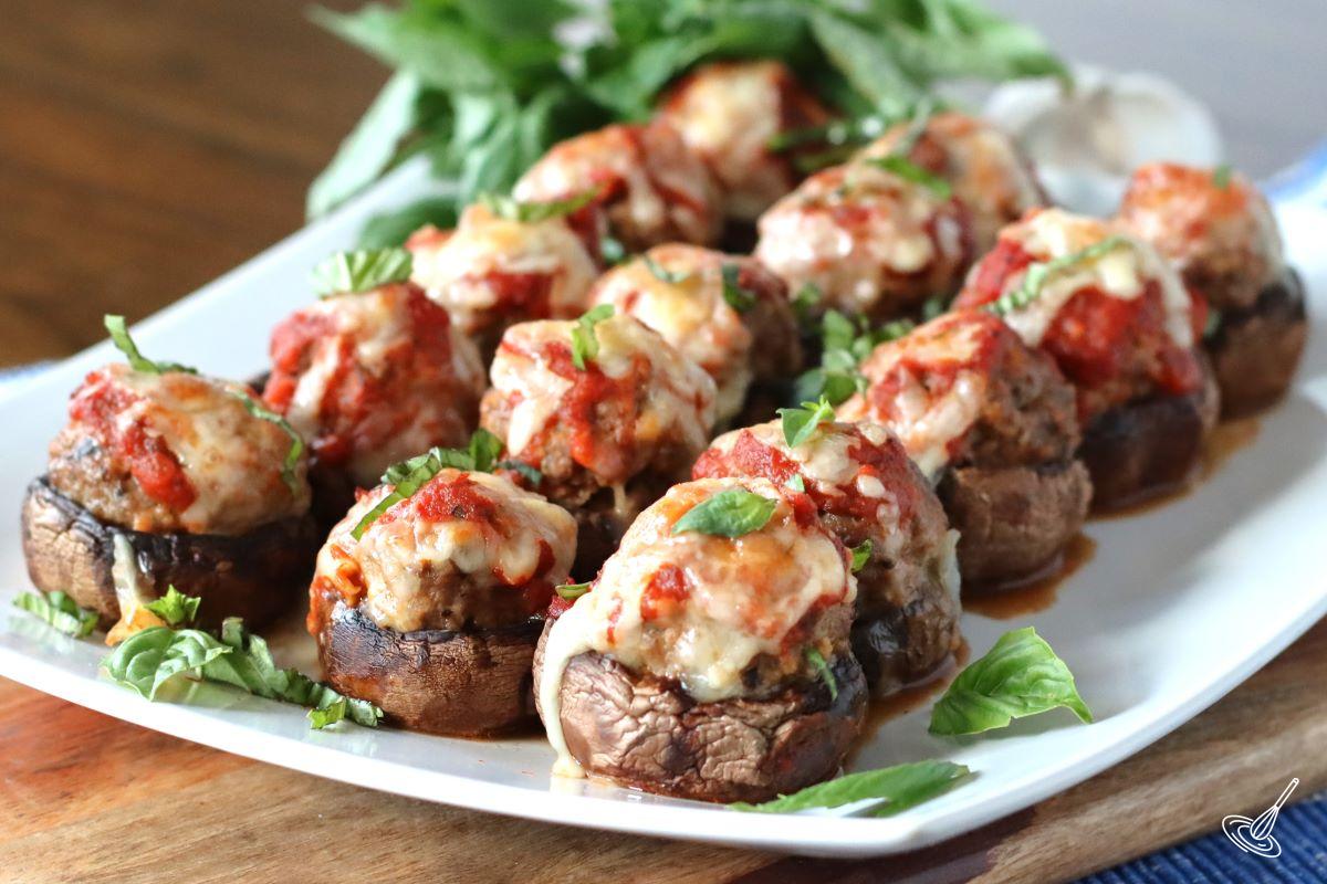 A platter of baked Meatball stuffed Mushrooms.