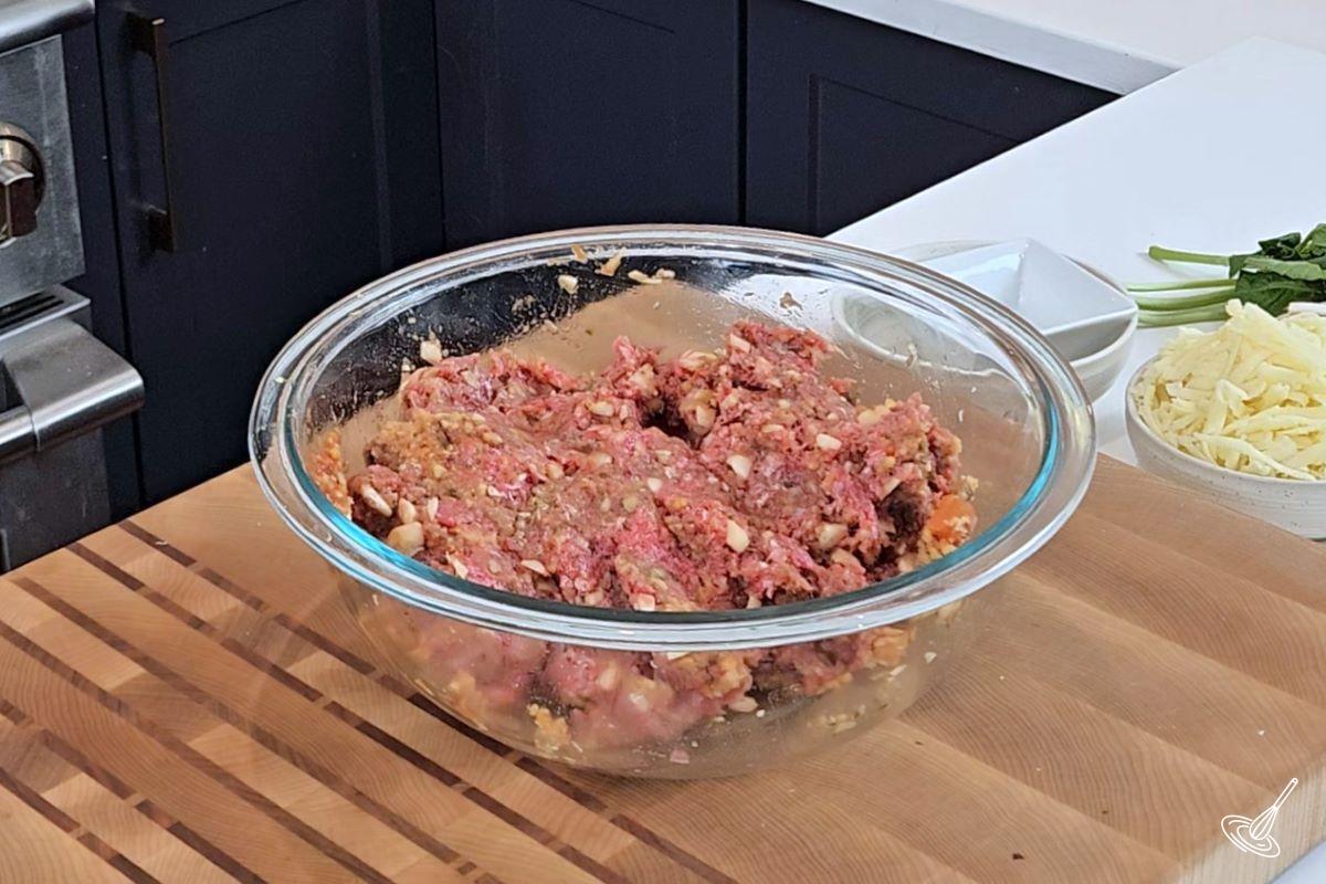 A bowl of meatball mixture. 