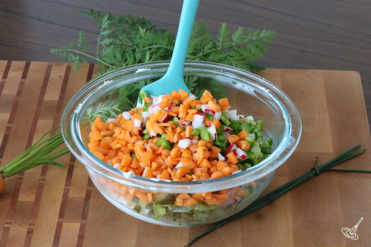 A large bowl containing finely diced vegetables. 